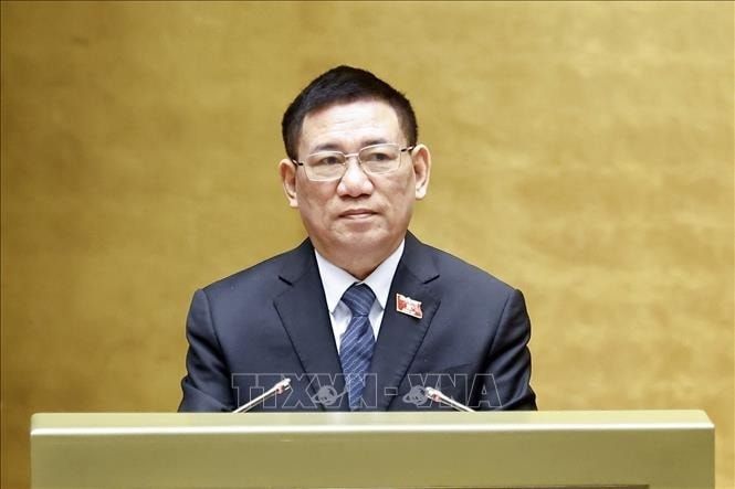 Phó Thủ tướng Chính phủ Hồ Đức Phớc trình bày Tờ trình về dự thảo Nghị quyết của Quốc hội về một số cơ chế, chính sách đặc thù nhằm nâng cao hiệu quả công tác hội nhập quốc tế. Ảnh: Doãn Tấn/TTXVN