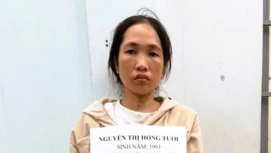 Nguyễn Thị Hồng Tươi tại cơ quan công an. Ảnh: CATĐN